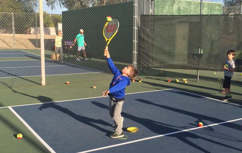 What is the junior tennis program at the Paseo Club?