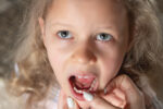 What To Do About a Loose Baby Tooth